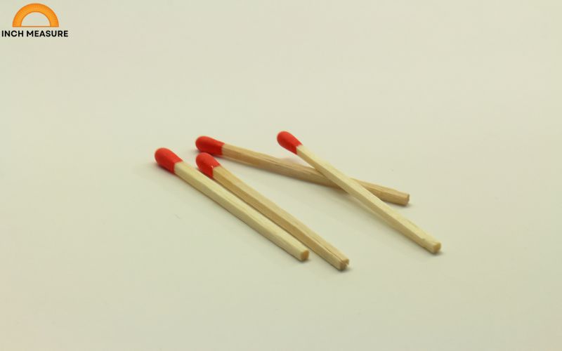 A standard wooden matchstick, used for lighting candles or fires, is approximately 4 cm long, making it an excellent reference for this measurement.