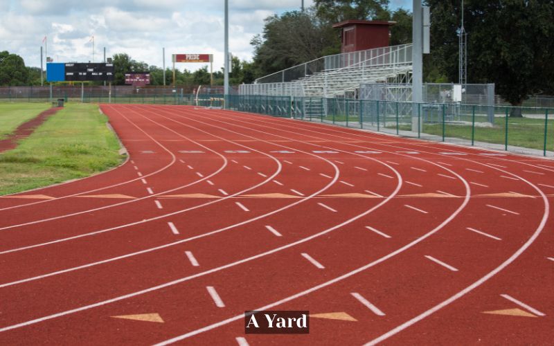 A Standard Track and Field Distance is About a Yard in Length