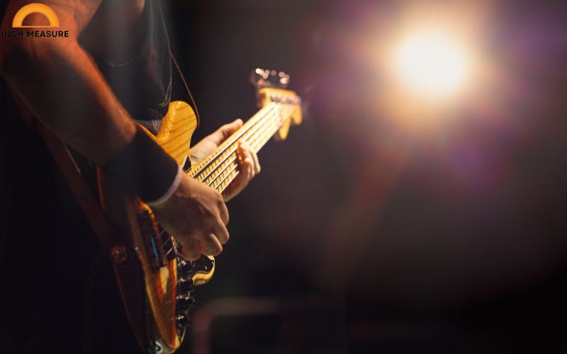 The body length of a standard acoustic guitar often measures about 18 inches.