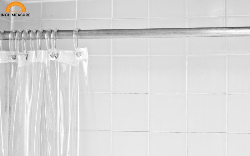A standard shower curtain typically measures 18 inches in length for the drop from the top of the curtain rod to the bottom hem