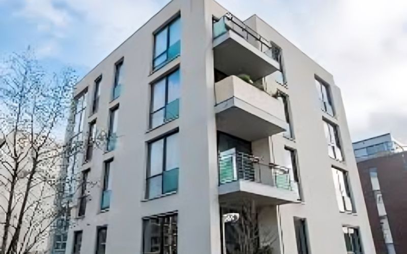 A small apartment building, especially in urban settings, might have a facade or length of 100 feet. 