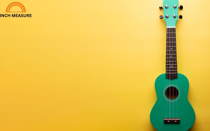 The body of a small guitar, such as a parlor or travel guitar, often measures around 20 inches in length from the bridge to the top of the body.